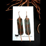 Patinaed copper earrings with dangling copper paddle